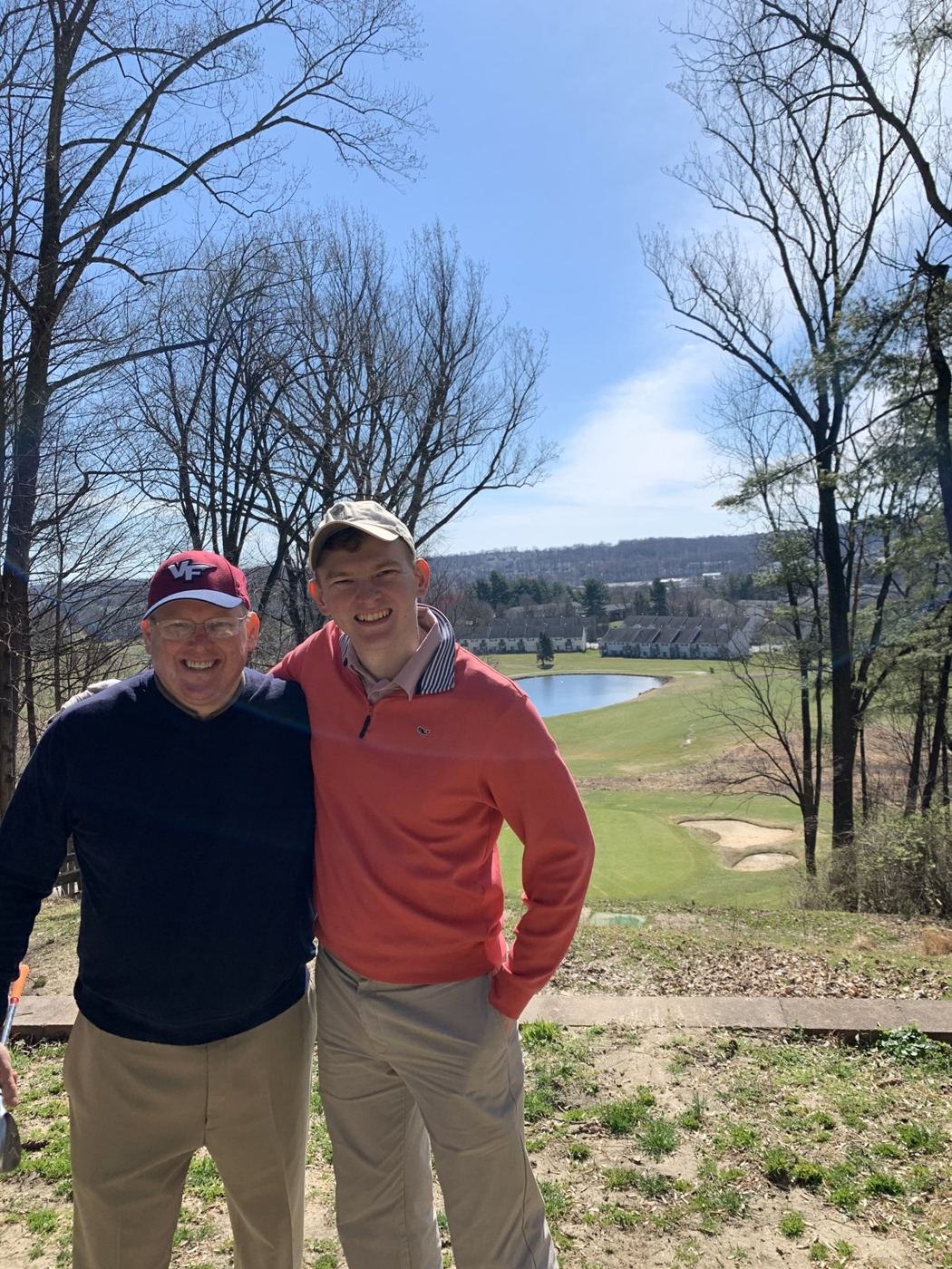 George and Jonathan Ruch standing above a golf course in early spring